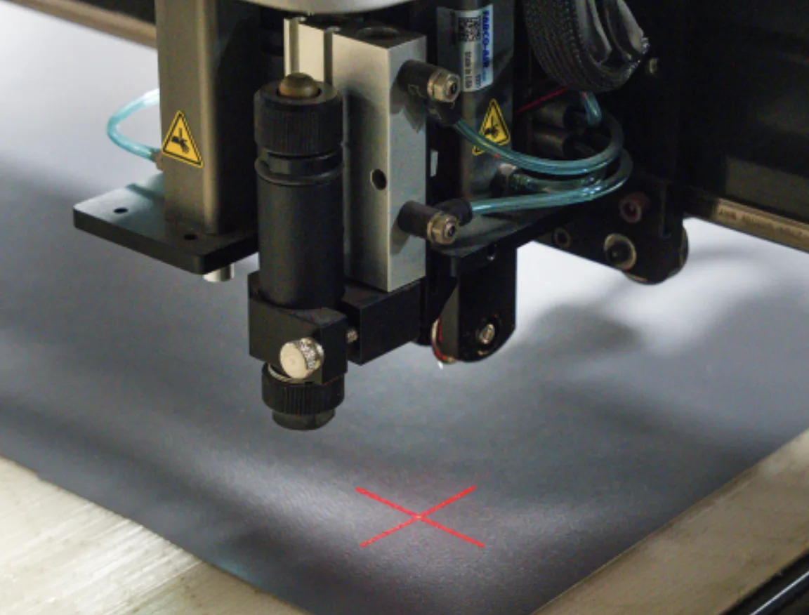 Precision laser-guided fabric cutting for awning components